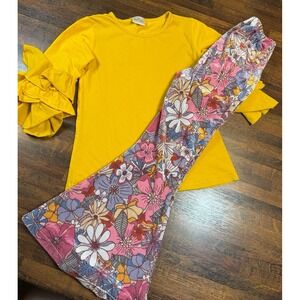 Groovy girl 70s vibe size 5/6 top and bell bottom pants.  Flower power fun.